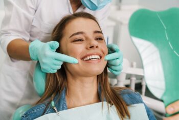 Woman smiling during tooth examination