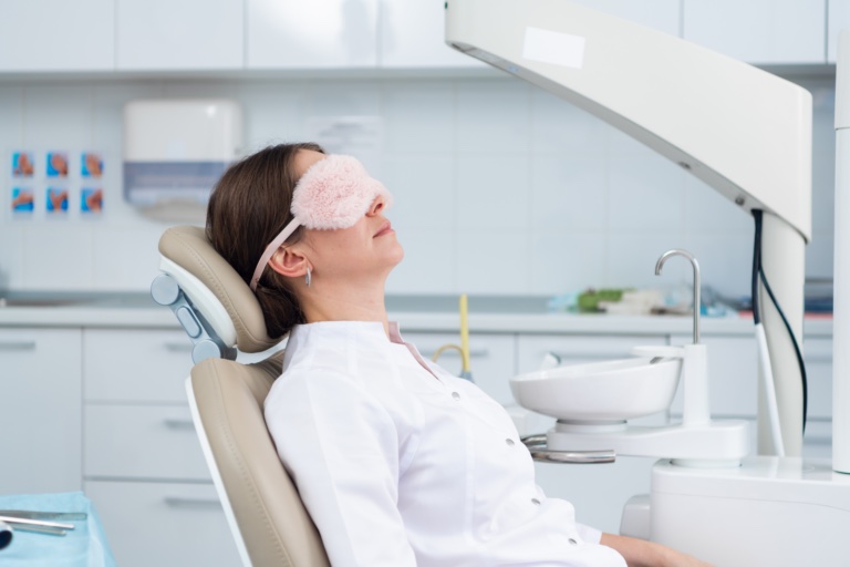 Woman Sleeping in Dental Chair